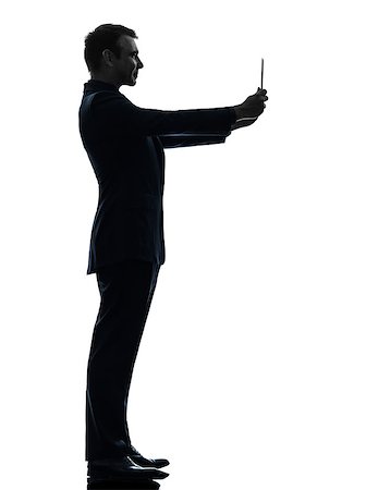 simsearch:400-08317008,k - one  business man holding photographing digital tablet in silhouette on white background Stockbilder - Microstock & Abonnement, Bildnummer: 400-08317002