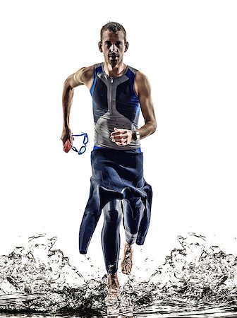 run triathlon - man triathlon iron man athlete swimmers swimmers running in silhouette on white background Stock Photo - Budget Royalty-Free & Subscription, Code: 400-08317128