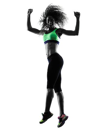 one african woman woman zumba dancer dancing exercises  in studio silhouette isolated on white background Stock Photo - Budget Royalty-Free & Subscription, Code: 400-08317389