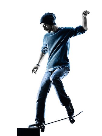 stake - one caucasian man skateboarder skateboarding  in silhouette isolated on white background Stock Photo - Budget Royalty-Free & Subscription, Code: 400-08318482