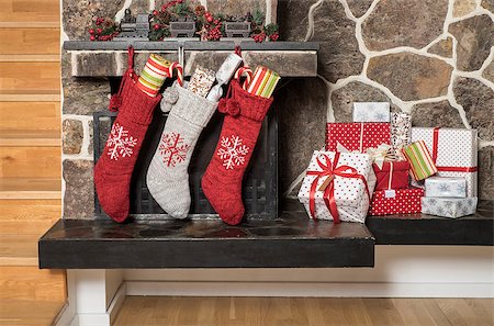 Stuffed stockings hanging on a fireplace on christmas morning Stock Photo - Budget Royalty-Free & Subscription, Code: 400-08318626