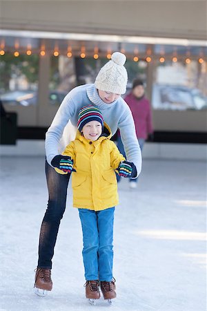 simsearch:400-08318057,k - young mother teaching her little son ice skating at outdoor skating rink Stock Photo - Budget Royalty-Free & Subscription, Code: 400-08318710