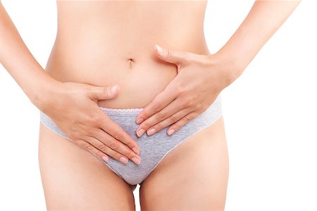 digestion female - Beautiful woman touching her belly in grey panties isolated on white background. Menstruation, period, pregnancy and weight loss. Feminine body. Foto de stock - Super Valor sin royalties y Suscripción, Código: 400-08318766