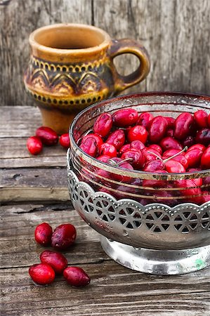 Ripe berry of the dogwood in an old vase on wooden background Stock Photo - Budget Royalty-Free & Subscription, Code: 400-08318807
