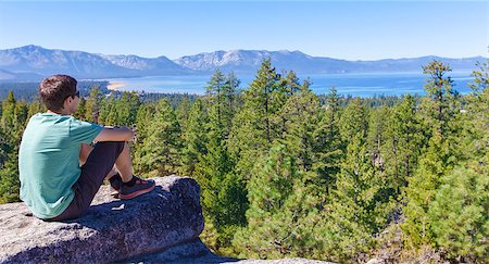 simsearch:400-07176526,k - panorama of young man resting after hike and enjoying gorgeous view at lake tahoe at summer Stock Photo - Budget Royalty-Free & Subscription, Code: 400-08318925