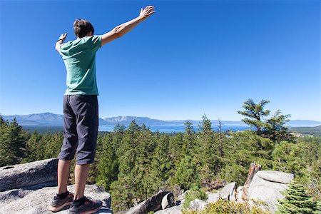 simsearch:400-07176526,k - young man feeling powerful after hiking near lake tahoe Stock Photo - Budget Royalty-Free & Subscription, Code: 400-08319719
