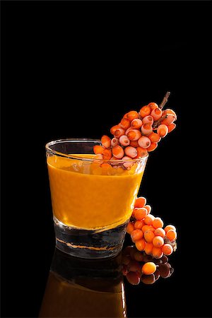 Sea buckthorn and sea buckthorn juice in glass isolated on black background. Healthy living, immune system booth. Stock Photo - Budget Royalty-Free & Subscription, Code: 400-08319740