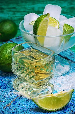 simsearch:400-05385152,k - one glass alcoholic drink and lime fruits on wooden texture.Selective focus Stock Photo - Budget Royalty-Free & Subscription, Code: 400-08313964