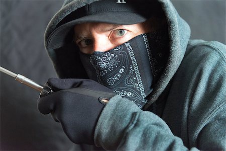 simsearch:400-05729571,k - Close-up of a burglar breaking in, right side of frame Stock Photo - Budget Royalty-Free & Subscription, Code: 400-08313979