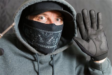 simsearch:400-05729571,k - Close-up of a burglar busted, with his hands and tools up Stock Photo - Budget Royalty-Free & Subscription, Code: 400-08313980