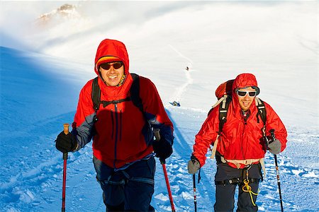 hikers at the top of a pass with backpacks meeting the sunrise in the mountains Stock Photo - Budget Royalty-Free & Subscription, Code: 400-08313981