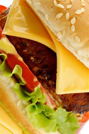 simsearch:400-06330800,k - Big Tasty Cheeseburger with Beef, Tomato, Cheese, Lettuce and Sesame Bun closeup on white background Stock Photo - Budget Royalty-Free & Subscription, Code: 400-08334812