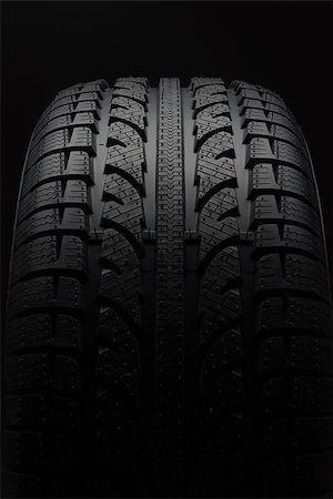 Close-up of car tire over black background Stock Photo - Budget Royalty-Free & Subscription, Code: 400-08335132