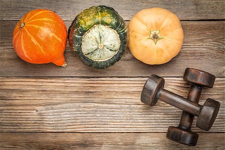 simsearch:400-07620929,k - weathered wood background with a couple of vintage dumbbells and winter squash Stock Photo - Budget Royalty-Free & Subscription, Code: 400-08335146