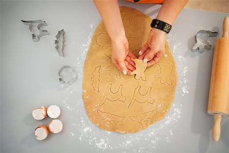 simsearch:400-08336563,k - Closeup on woman making Halloween biscuits from rolled fresh dough in kitchen. Traditional autumn holiday. Upper view Stock Photo - Budget Royalty-Free & Subscription, Code: 400-08336561