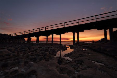 simsearch:400-07514503,k - The eroded cratered rocks under the bridge at Bare Island,  La Perouse Botany Bay as the sun sets Stock Photo - Budget Royalty-Free & Subscription, Code: 400-08336584