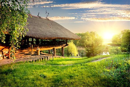 House of log near lake at sunset Stock Photo - Budget Royalty-Free & Subscription, Code: 400-08337118