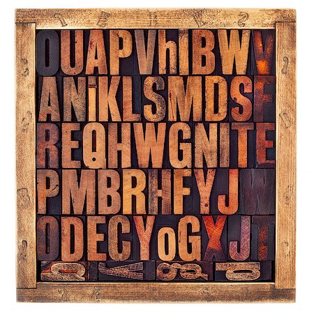simsearch:400-08335158,k - random letters of alphabet - vintage letterpress wood type printing blocks in a rustic box isolated on white Photographie de stock - Aubaine LD & Abonnement, Code: 400-08337226