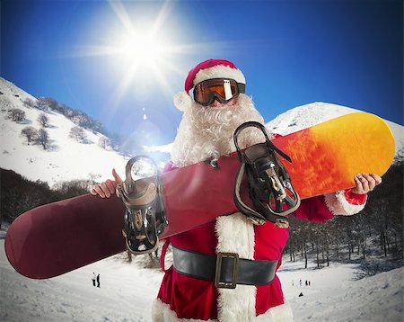 santa claus ski - Santa Claus with snowboard in the mountains Foto de stock - Super Valor sin royalties y Suscripción, Código: 400-08338115