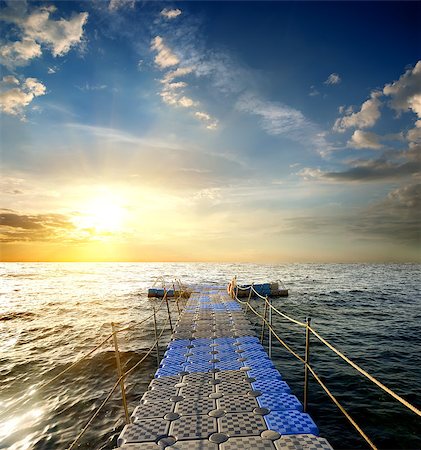 Pontoon with handrails in the sea at sunset Stock Photo - Budget Royalty-Free & Subscription, Code: 400-08338126