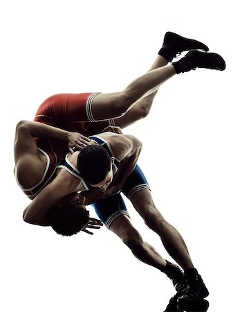 two caucasian wrestlers wrestling men on isolated silhouette white background Stock Photo - Budget Royalty-Free & Subscription, Code: 400-08338238