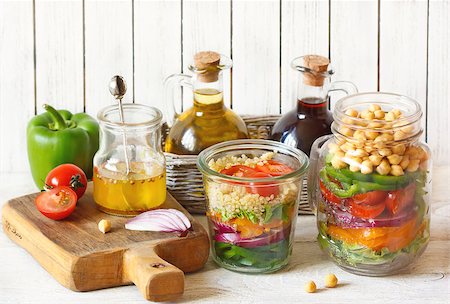 salad in a jar - Heallthy chickpeas and quinoa salads and fresh food ingredients on kitchen table. Stock Photo - Budget Royalty-Free & Subscription, Code: 400-08338416