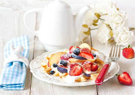 Fresh homemade waffles with whipped cream and fruit for breakfast. Stock Photo - Budget Royalty-Free & Subscription, Code: 400-08338464