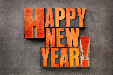 simsearch:400-08223086,k - Happy New Year! - text in vintage letterpress wood type blocks stained by red ink on a grunge metal background Stockbilder - Microstock & Abonnement, Bildnummer: 400-08339041