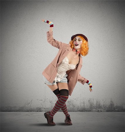 Colorful clown woman in a extravagant pose Photographie de stock - Aubaine LD & Abonnement, Code: 400-08339108