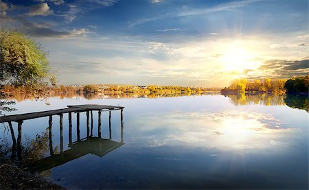 Wooden pier on autumn river at sunrise Stock Photo - Budget Royalty-Free & Subscription, Code: 400-08339395
