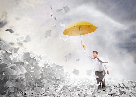 flying in air guy - Man comes out of a sheets pile Stock Photo - Budget Royalty-Free & Subscription, Code: 400-08339469