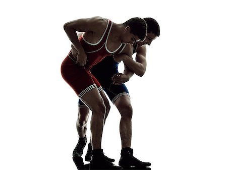 two caucasian wrestlers wrestling men on isolated silhouette white background Stock Photo - Budget Royalty-Free & Subscription, Code: 400-08339602