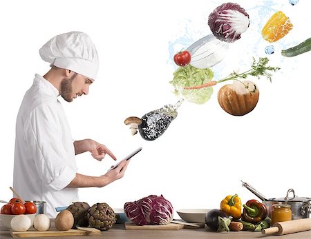 Chef reads a recipe from the tablet Stock Photo - Budget Royalty-Free & Subscription, Code: 400-08339732