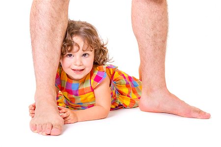 Little daughter feeling happy and protected at the feet of her father Foto de stock - Super Valor sin royalties y Suscripción, Código: 400-08339845