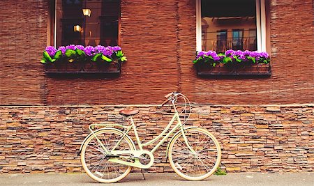 riding bike with basket - Beautiful retro bicycle stands at the green wall Stock Photo - Budget Royalty-Free & Subscription, Code: 400-08332059