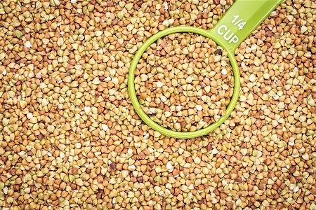 simsearch:400-06556120,k - background and texture of buckwheat kasha with a measuring scoop - gluten free grain Fotografie stock - Microstock e Abbonamento, Codice: 400-08332283