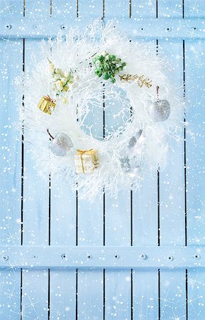 simsearch:400-07824858,k - Christmas wreath with decorations hanging on blue wooden wall with snow. Stock Photo - Budget Royalty-Free & Subscription, Code: 400-08332812