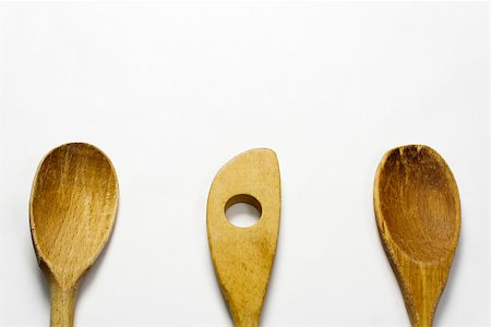 simsearch:400-07481889,k - Three wooden cooking spoons against a white background. Foto de stock - Royalty-Free Super Valor e Assinatura, Número: 400-08332826