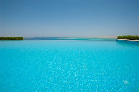 paulvinten (artist) - View from a luxury infinity swimming pool with tropical sea outlook Stockbilder - Microstock & Abonnement, Bildnummer: 400-08332840