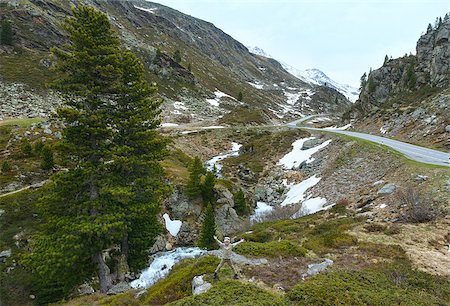 switzerland people on road - Summer mountain landscape with road, stream and boy near (Fluela Pass, Switzerland) Stock Photo - Budget Royalty-Free & Subscription, Code: 400-08332893