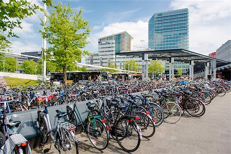 simsearch:400-08333188,k - Eindhoven, Netherlands - May 24, 2015: Bicycle parking area in Eindhoven bus central station. Bicycles are popular way to get around for the Dutch Foto de stock - Super Valor sin royalties y Suscripción, Código: 400-08332917