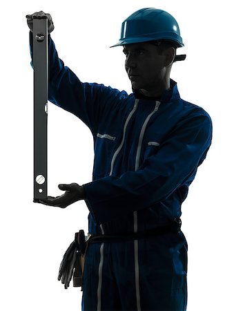 silhouette as carpenter - one  man construction worker holding level silhouette in studio on white background Stock Photo - Budget Royalty-Free & Subscription, Code: 400-08333539