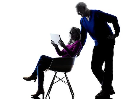 simsearch:400-08317008,k - one caucasian couple senior looking at  digital tablet computer  silhouette  in silhouette studio isolated on white background Stockbilder - Microstock & Abonnement, Bildnummer: 400-08333814