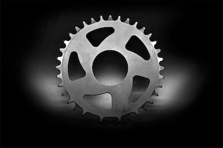 simsearch:400-09089843,k - Silver bicycle chainring on a black background. Stock Photo - Budget Royalty-Free & Subscription, Code: 400-08333839