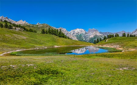 Mont Thabor and its reflection in the Lake Chavillon on Etroite Valley in Hautes-Alpes, France. Photographie de stock - Aubaine LD & Abonnement, Code: 400-08333909