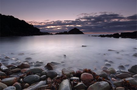 simsearch:400-07667033,k - Dawn skies pre sunrise long exposure and cool colours at Mimosa Rocks, Aragunnu.  This little bay foreshore is full of pebbles and no sand.  Stones range in size and colour.  Far south coast NSW, Australia Stock Photo - Budget Royalty-Free & Subscription, Code: 400-08333920