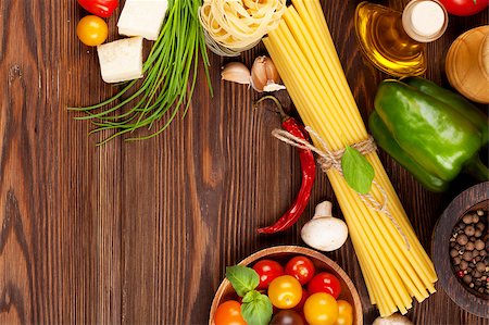 simsearch:400-08890289,k - Italian food cooking ingredients. Pasta, vegetables, spices. Top view with copy space Foto de stock - Royalty-Free Super Valor e Assinatura, Número: 400-08344228