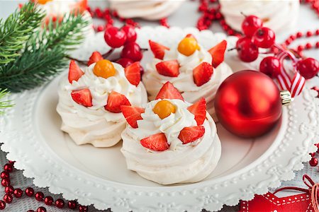 pavlova - Pavlova meringue cake decorated with fresh strawberry and cape gooseberry on festive background Stock Photo - Budget Royalty-Free & Subscription, Code: 400-08344400