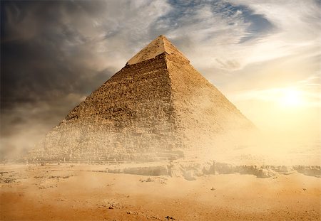 simsearch:400-09222068,k - Pyramid in sand dust under gray clouds Stock Photo - Budget Royalty-Free & Subscription, Code: 400-08345034