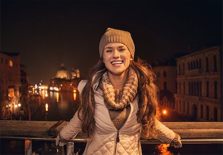 simsearch:400-08344334,k - Tune in for charming winter time in Venice, Italy. Portrait of happy young woman standing on a bridge overlooking Grand canal Stock Photo - Budget Royalty-Free & Subscription, Code: 400-08345284